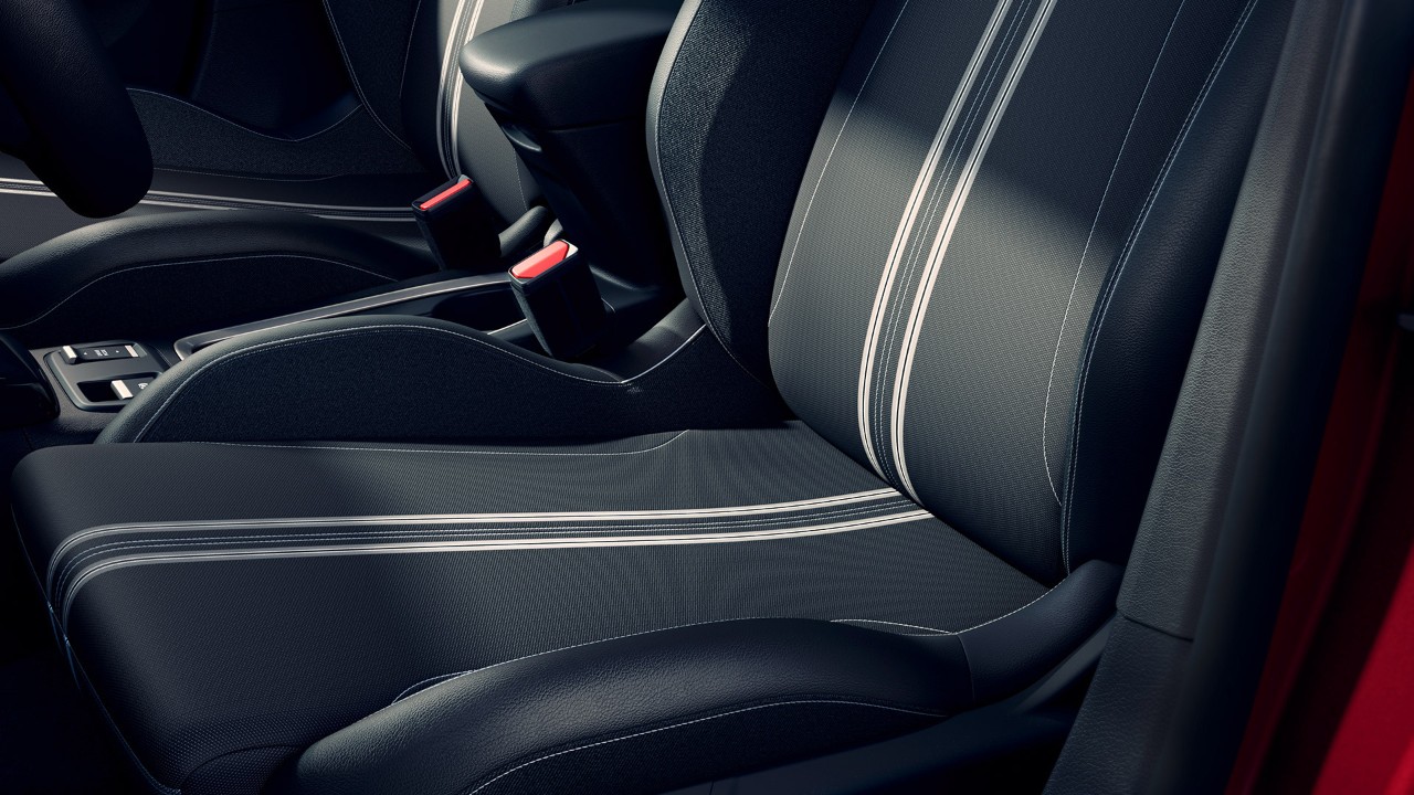 Close-up van de tweekleurige zetel met zwart-grijs motief van de Opel Corsa